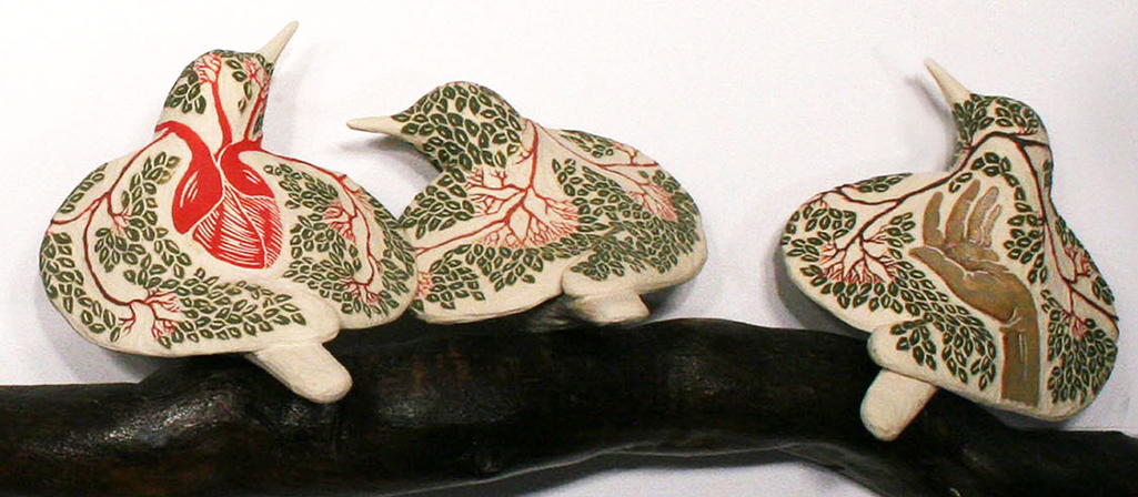 cathy weber - art - clay- woman - montana - ceramic - porcelain - bird - red wing - redwing - forest - carved - heart - tree - hand